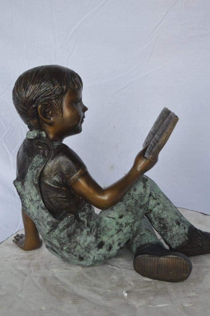 Young Girl Laying and Reading Book Bronze Statue - Size: 18" L x 9" W x 16" H.