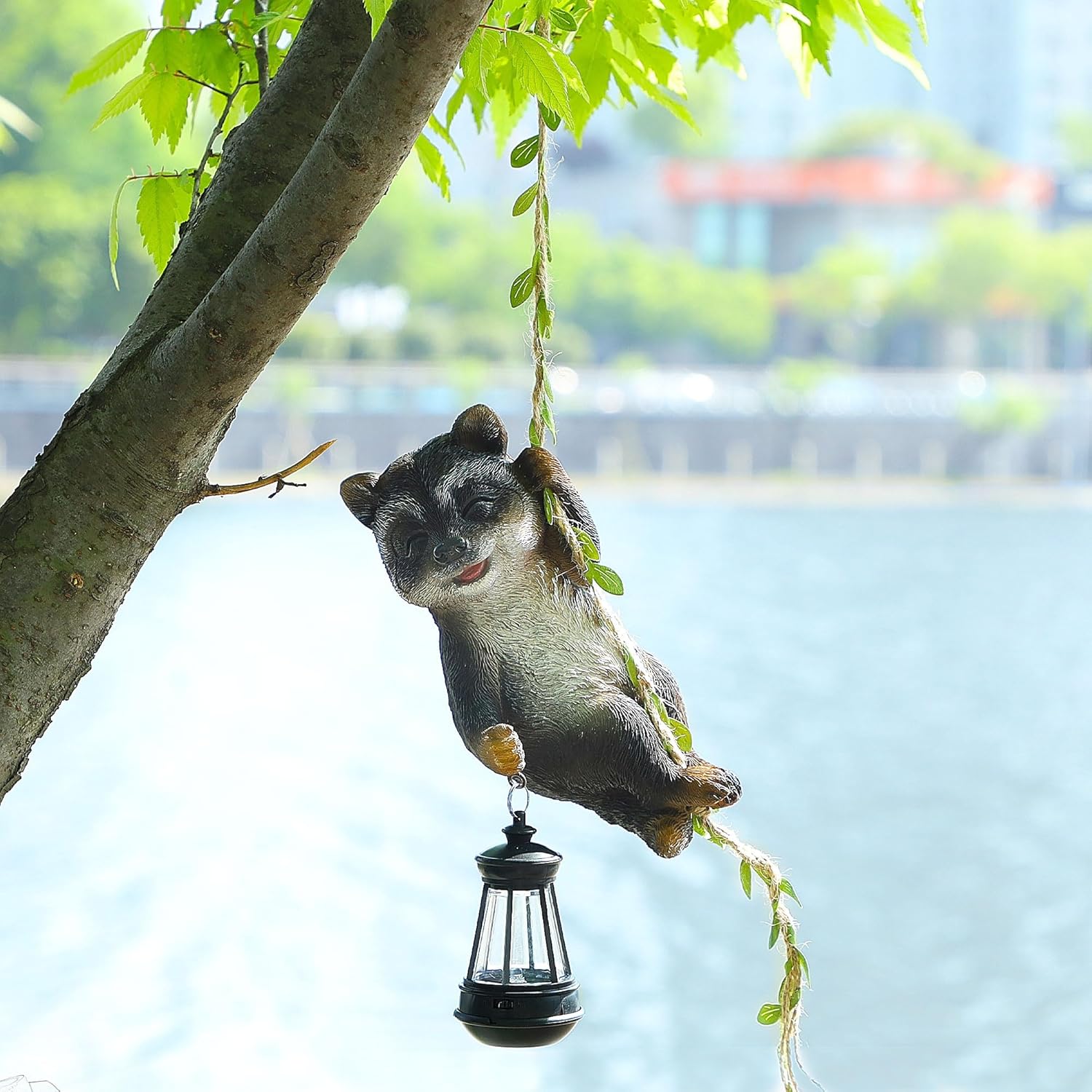 Joliyoou 1 Pack Solar Light Outdoor Statues, 6.5"H Resin Raccoon Climbing On A 23.6"L Vine with LED Lantern, Waterproof Hanging Animal Figurine with Hook for Yard Garden Wall Balcony Tree Decoration